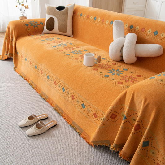 Housse réversible pour canapé bohème avec pompons – style chic et cosy