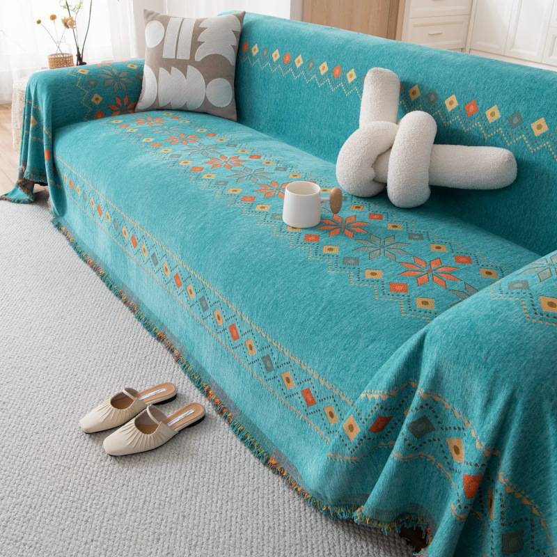 Housse réversible pour canapé bohème avec pompons – style chic et cosy